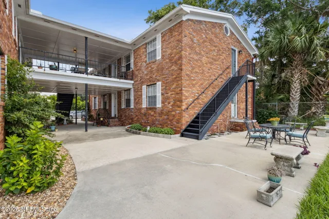 an outdoor view of house with outdoor seating