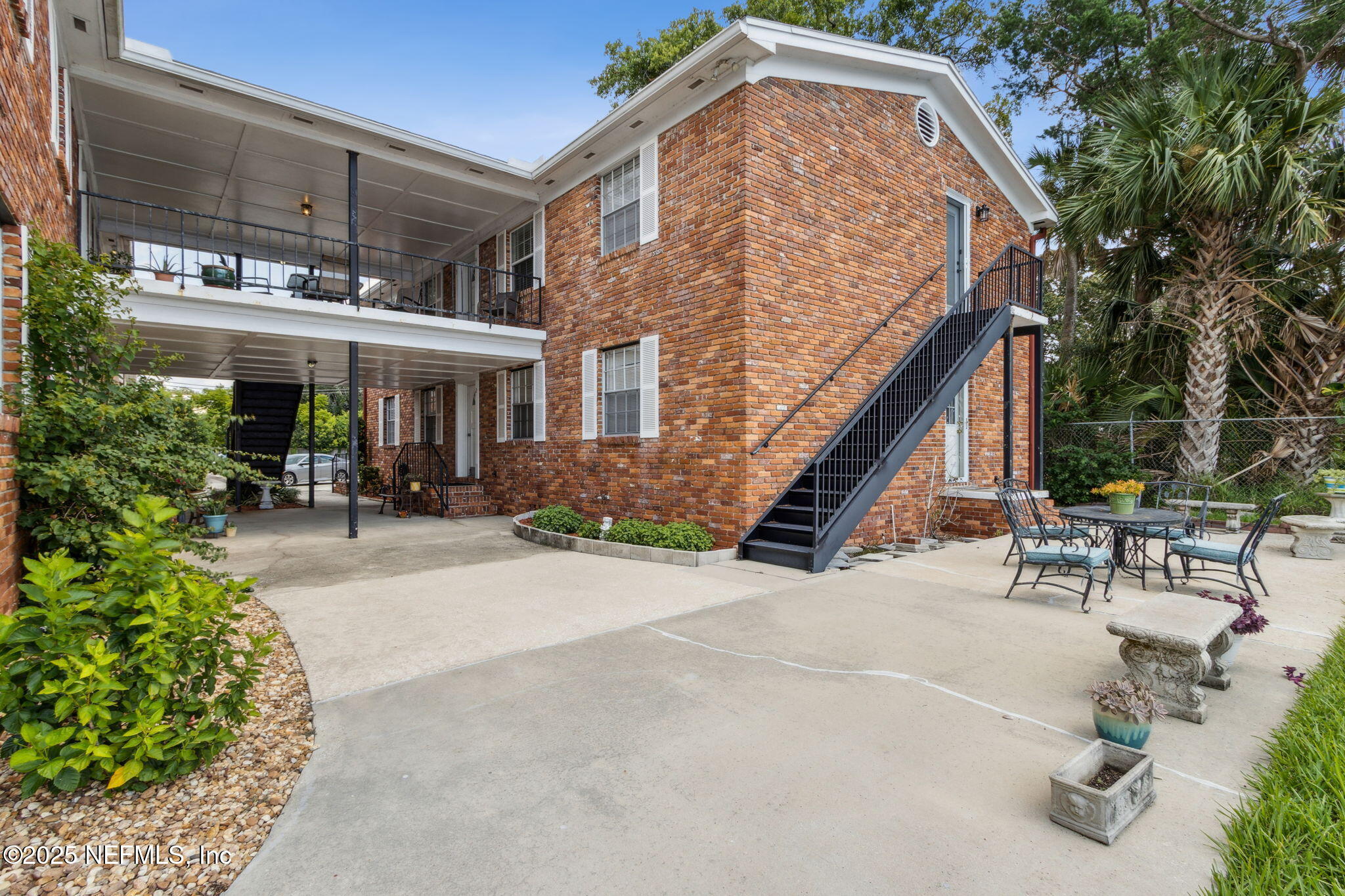 1846 Mallory Street, Unit 8 Jacksonville, FL 32205 - Photo 3 of 25 an outdoor view of house with outdoor seating