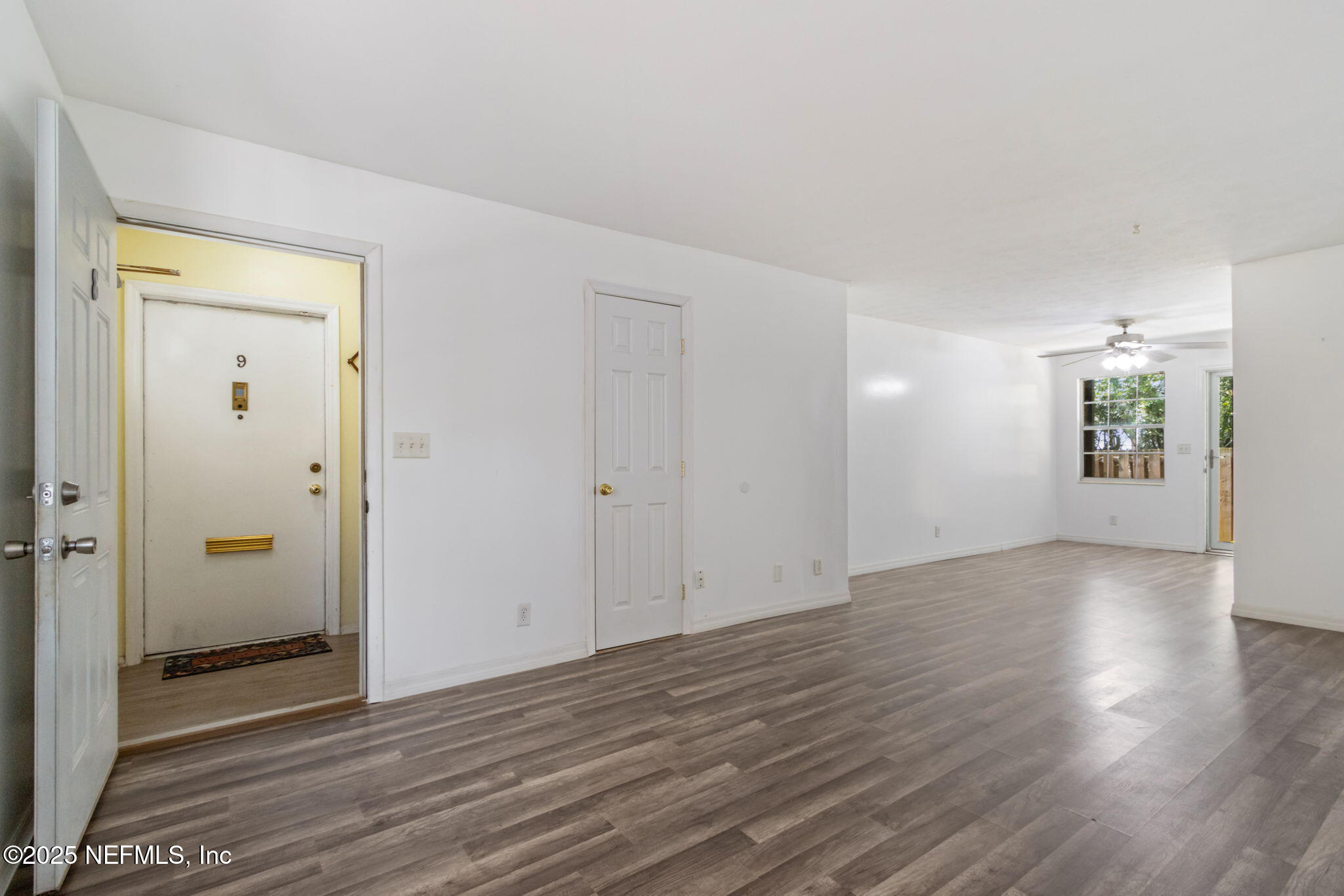 1846 Mallory Street, Unit 8 Jacksonville, FL 32205 - Photo 5 of 25 an empty room with wooden floor and windows