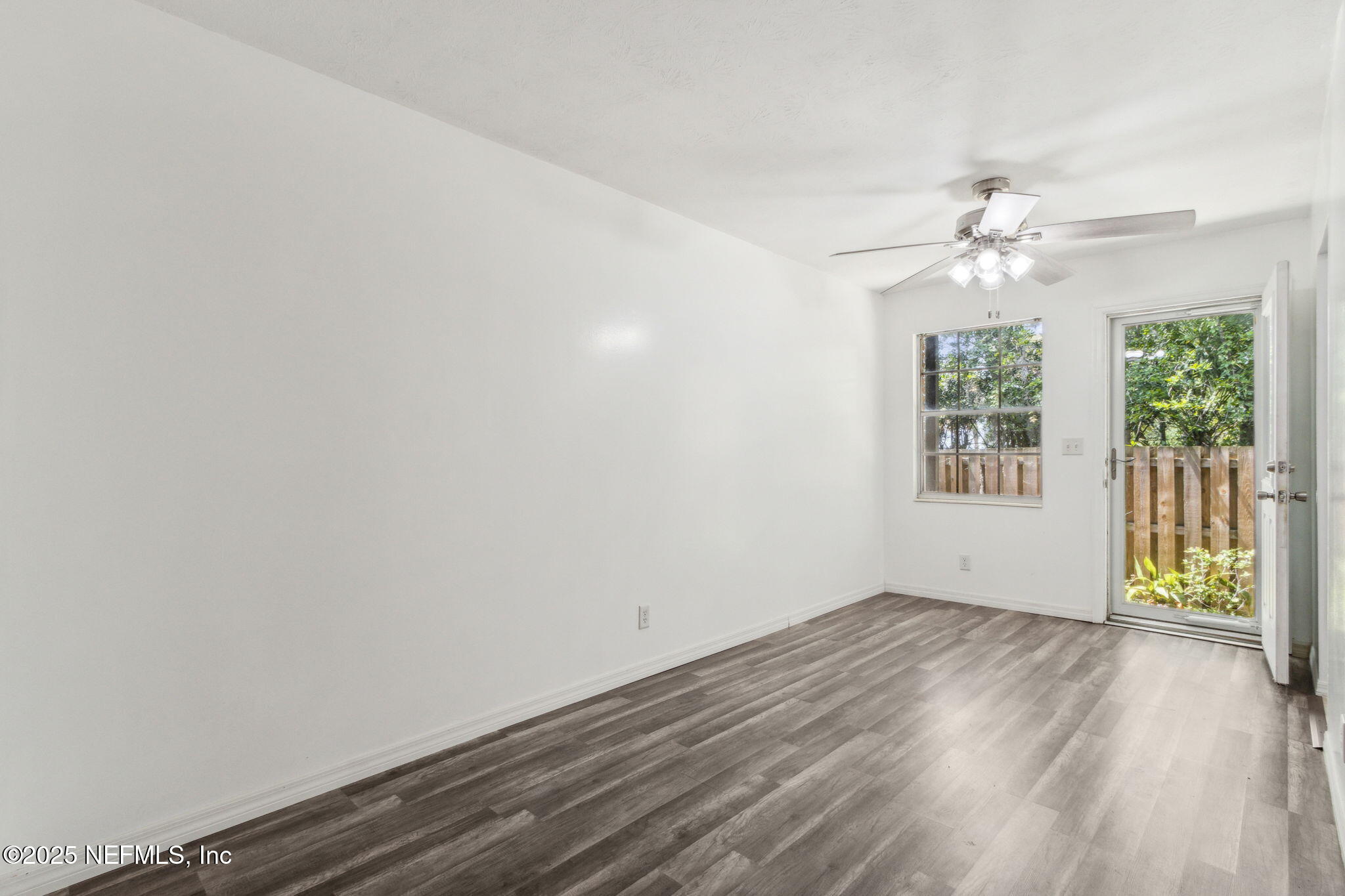 1846 Mallory Street, Unit 8 Jacksonville, FL 32205 - Photo 10 of 25 wooden floor in an empty room with a window