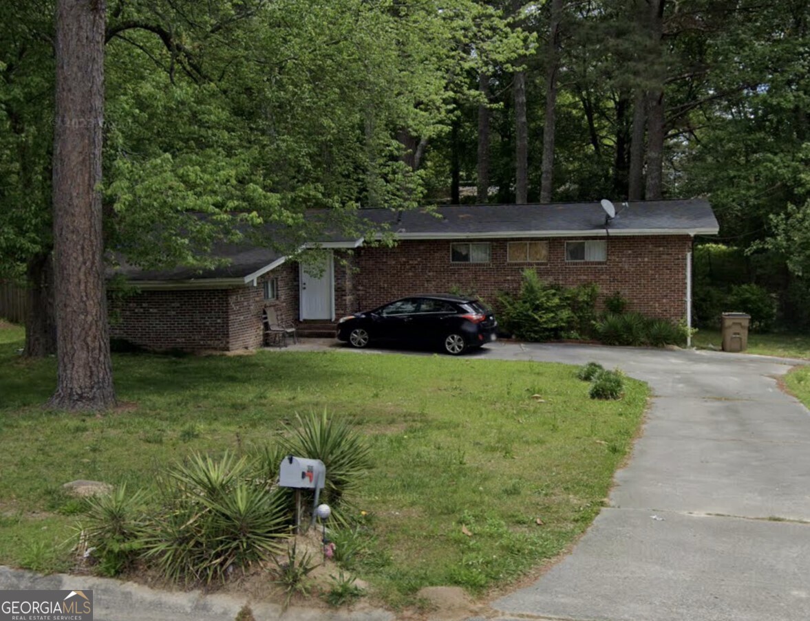 6484 Maddox Road Morrow, GA 30260 - Photo 1 of 1 front view of a house with a yard