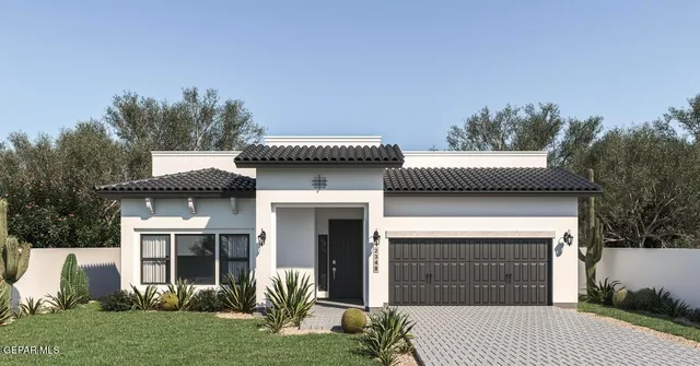 a front view of a house with a garden and plants