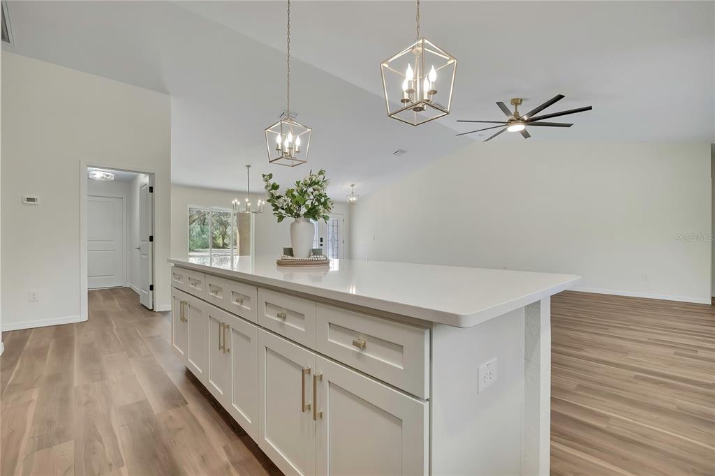 11929 West Cornflower Drive Crystal River, FL 34428 - Photo 11 of 50 a spacious bathroom with a granite countertop sink a mirror and a vanity