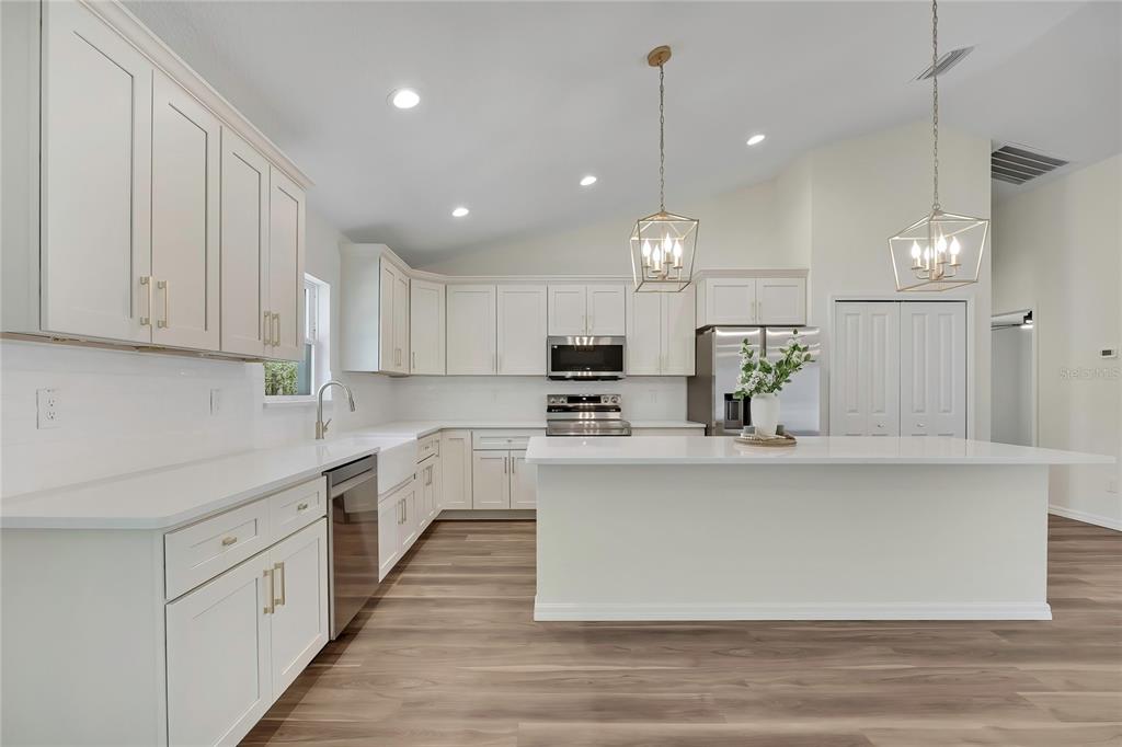 11929 West Cornflower Drive Crystal River, FL 34428 - Photo 2 of 50 a large kitchen with cabinets