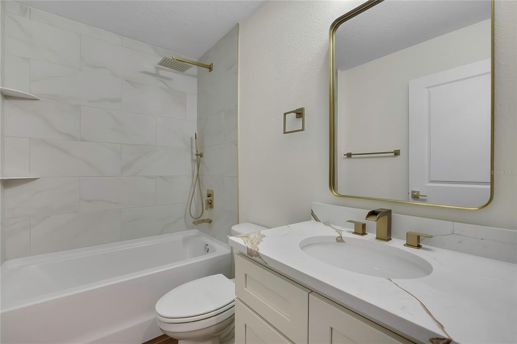 11929 West Cornflower Drive Crystal River, FL 34428 - Photo 30 of 50 a bathroom with a sink toilet vanity and shower
