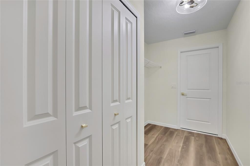 11929 West Cornflower Drive Crystal River, FL 34428 - Photo 33 of 50 a view of a hallway with wooden floor