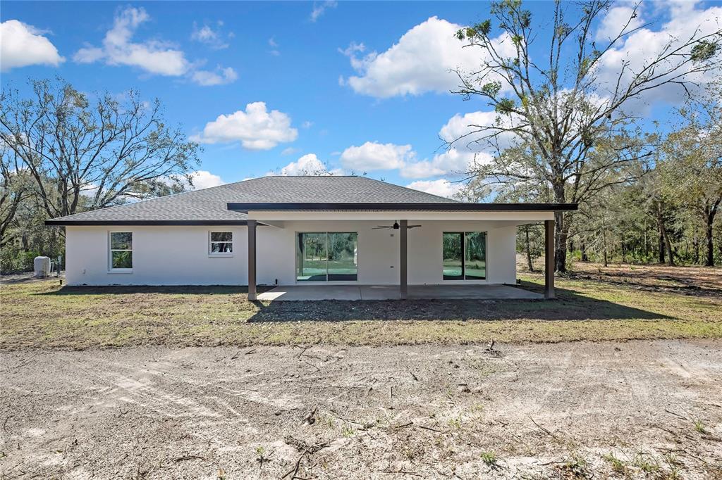 11929 West Cornflower Drive Crystal River, FL 34428 - Photo 40 of 50 a view of a house with a yard