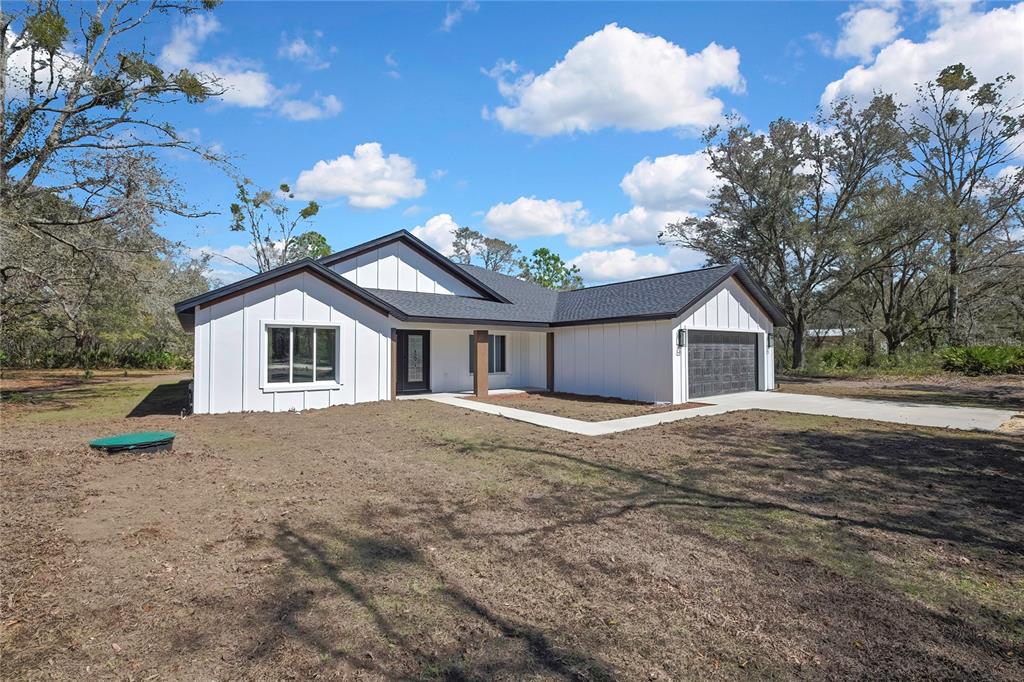 11929 West Cornflower Drive Crystal River, FL 34428 - Photo 42 of 50 a view of a house with a yard