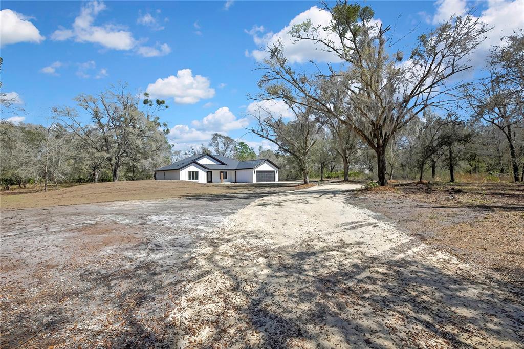 11929 West Cornflower Drive Crystal River, FL 34428 - Photo 44 of 50 a view of outdoor space with trees all around