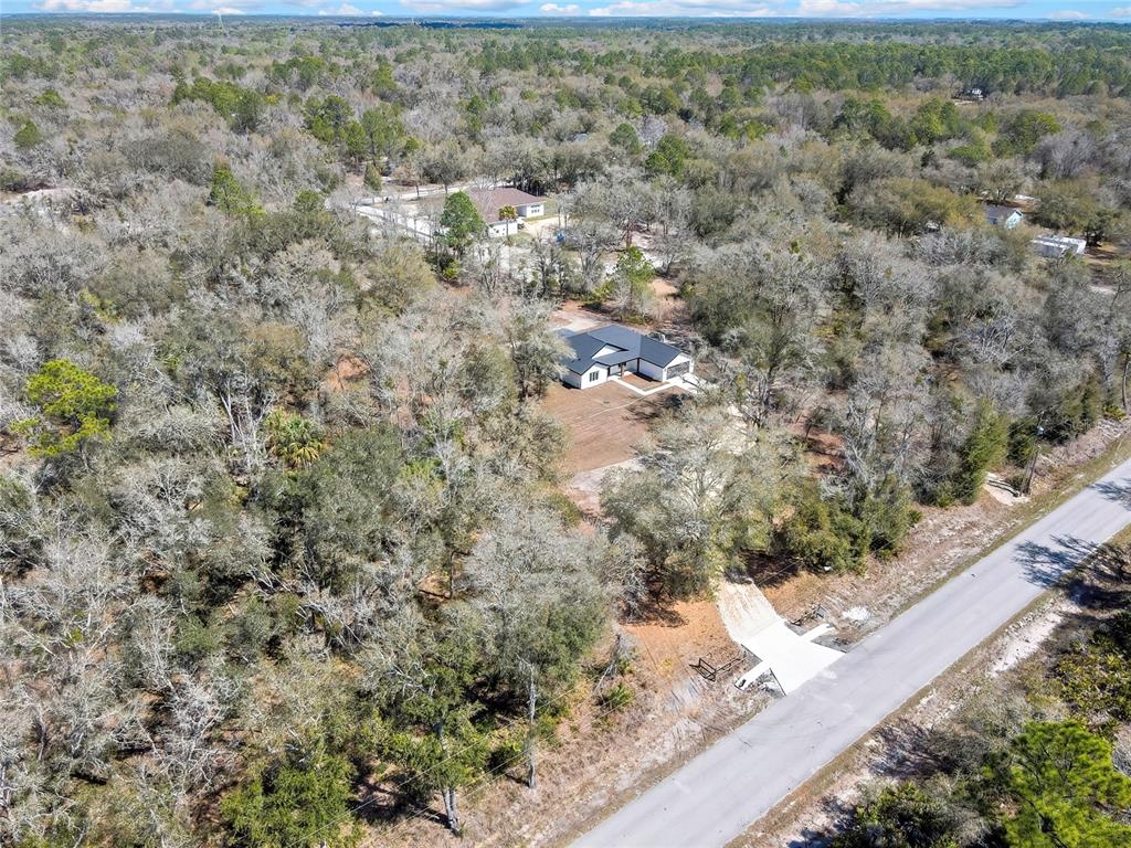 11929 West Cornflower Drive Crystal River, FL 34428 - Photo 46 of 50 a view of a yard with wooden fence