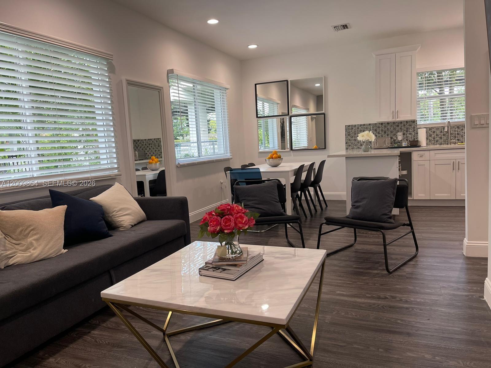 4034 Northwest 23rd Avenue Miami, FL 33142 - Photo 3 of 10 a living room with furniture and wooden floor