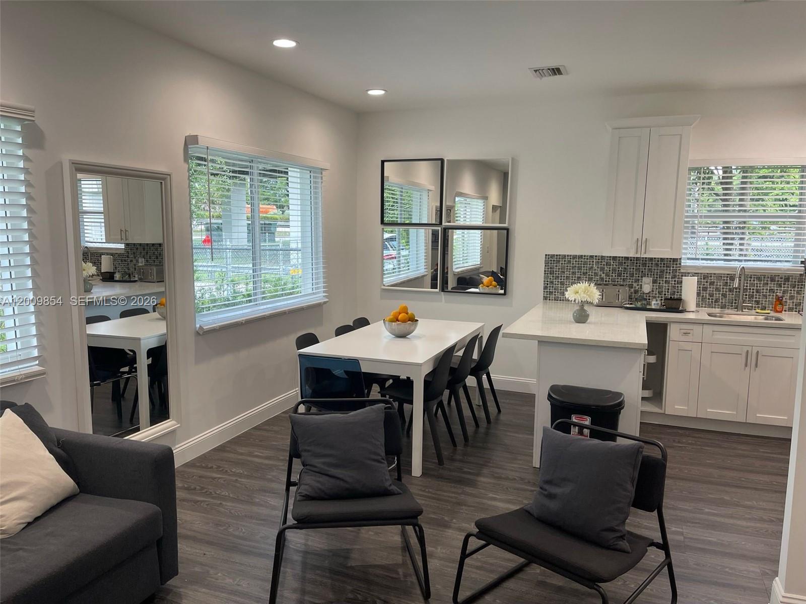 4034 Northwest 23rd Avenue Miami, FL 33142 - Photo 4 of 10 a view of a dining room with furniture window and outside view
