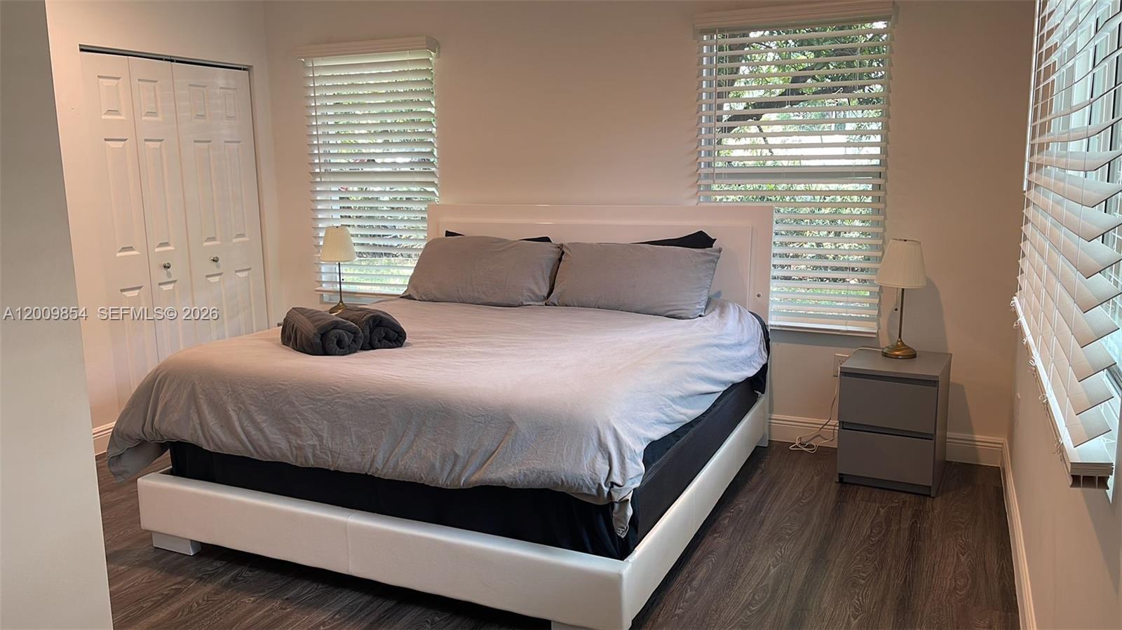 4034 Northwest 23rd Avenue Miami, FL 33142 - Photo 8 of 10 a bedroom with a bed and a window