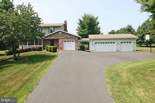 897 Bear Branch Road Westminster, MD 21157 - Photo 7 of 24 a view of a house with a yard and large trees