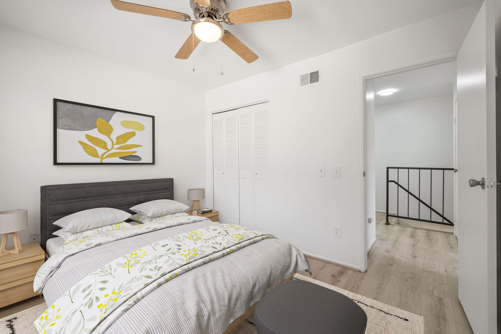 72644 Raven Road, Unit 2 Palm Desert, CA 92260 - Photo 14 of 21 a bedroom with a bed and painting on the wall