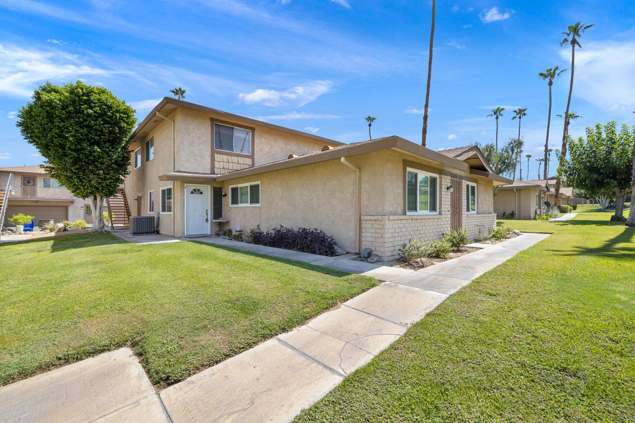 72644 Raven Road, Unit 2 Palm Desert, CA 92260 - Photo 3 of 21 a view of a house with a backyard