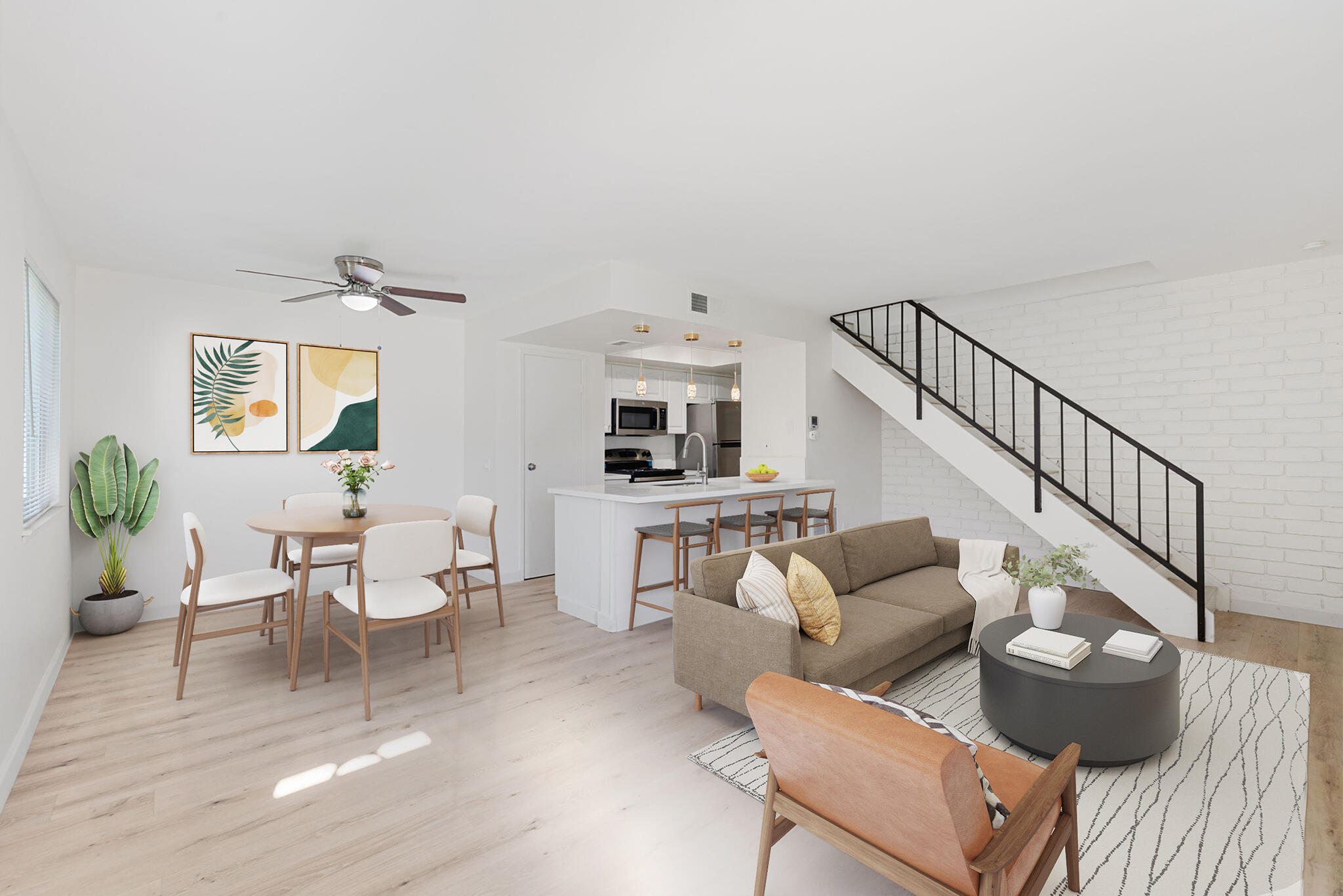 72644 Raven Road, Unit 2 Palm Desert, CA 92260 - Photo 4 of 21 a living room with furniture and wooden floor