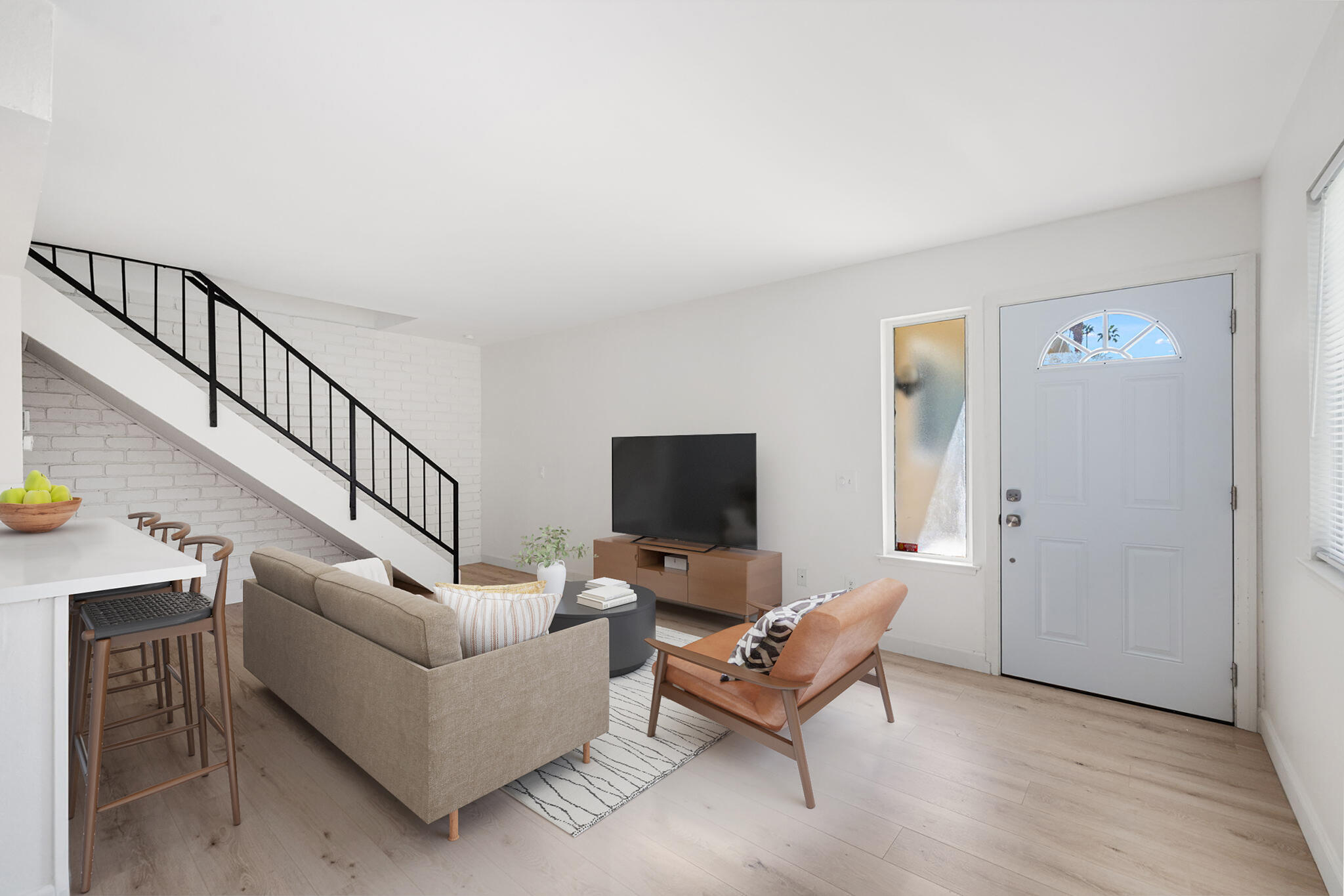 72644 Raven Road, Unit 2 Palm Desert, CA 92260 - Photo 8 of 21 a living room with furniture and a flat screen tv