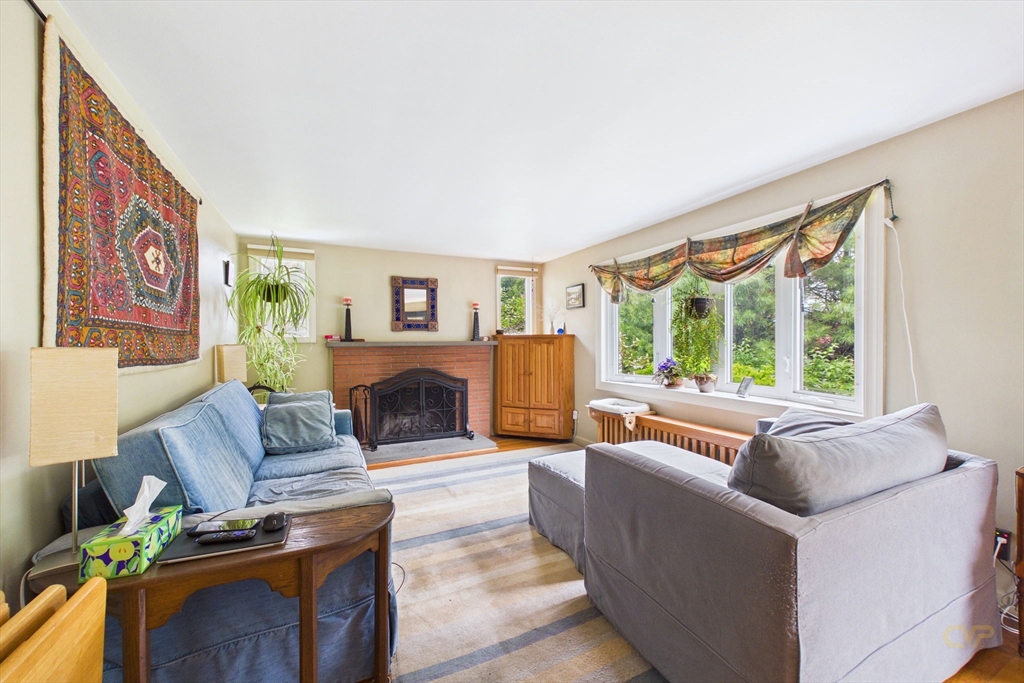 70 Neponset Street Canton, MA 02021 - Photo 4 of 39 a living room with fireplace furniture and a large window