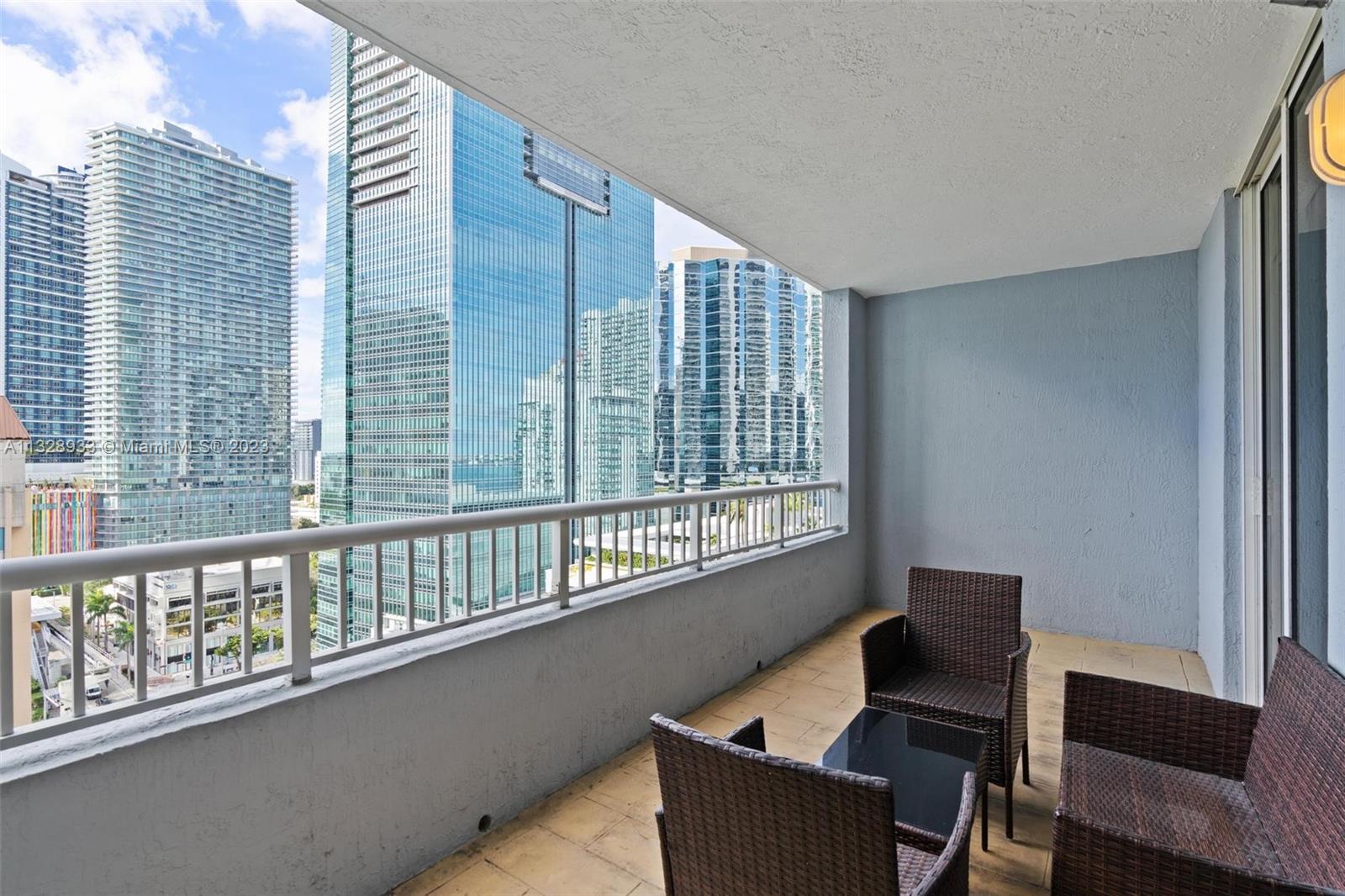 170 Southeast 14th Street, Unit 1906 Miami, FL 33131 - Photo 16 of 26 a living room with furniture and a window