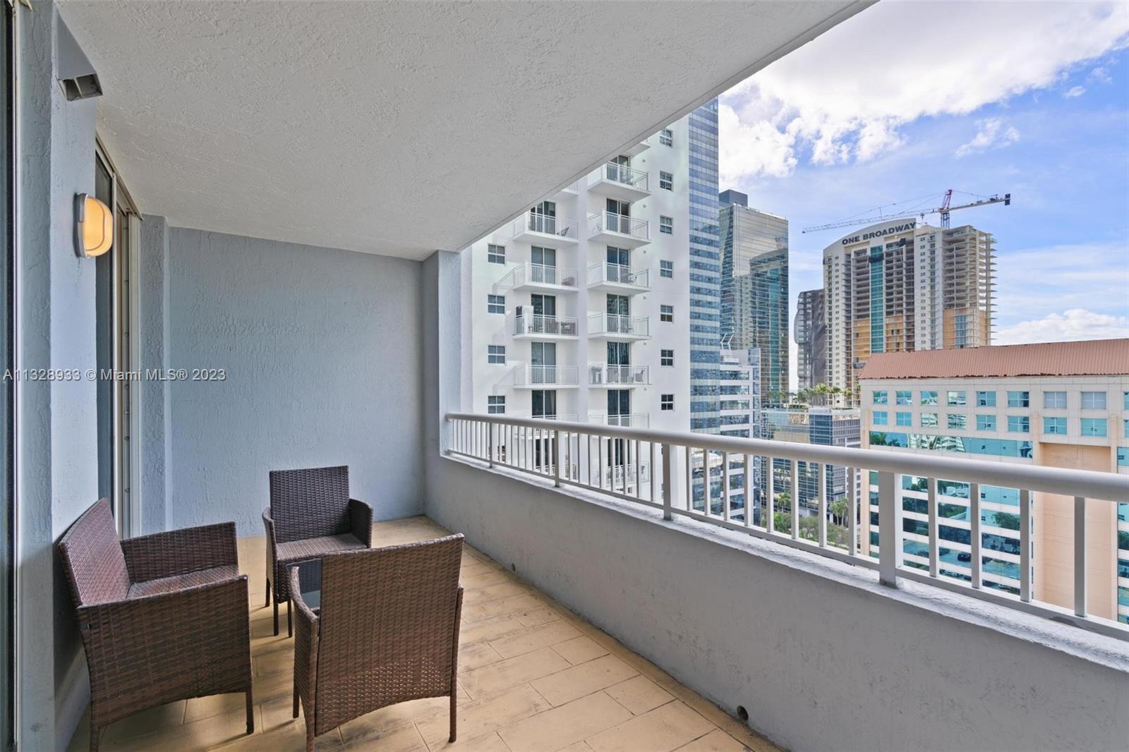 170 Southeast 14th Street, Unit 1906 Miami, FL 33131 - Photo 17 of 26 a view of a balcony with furniture