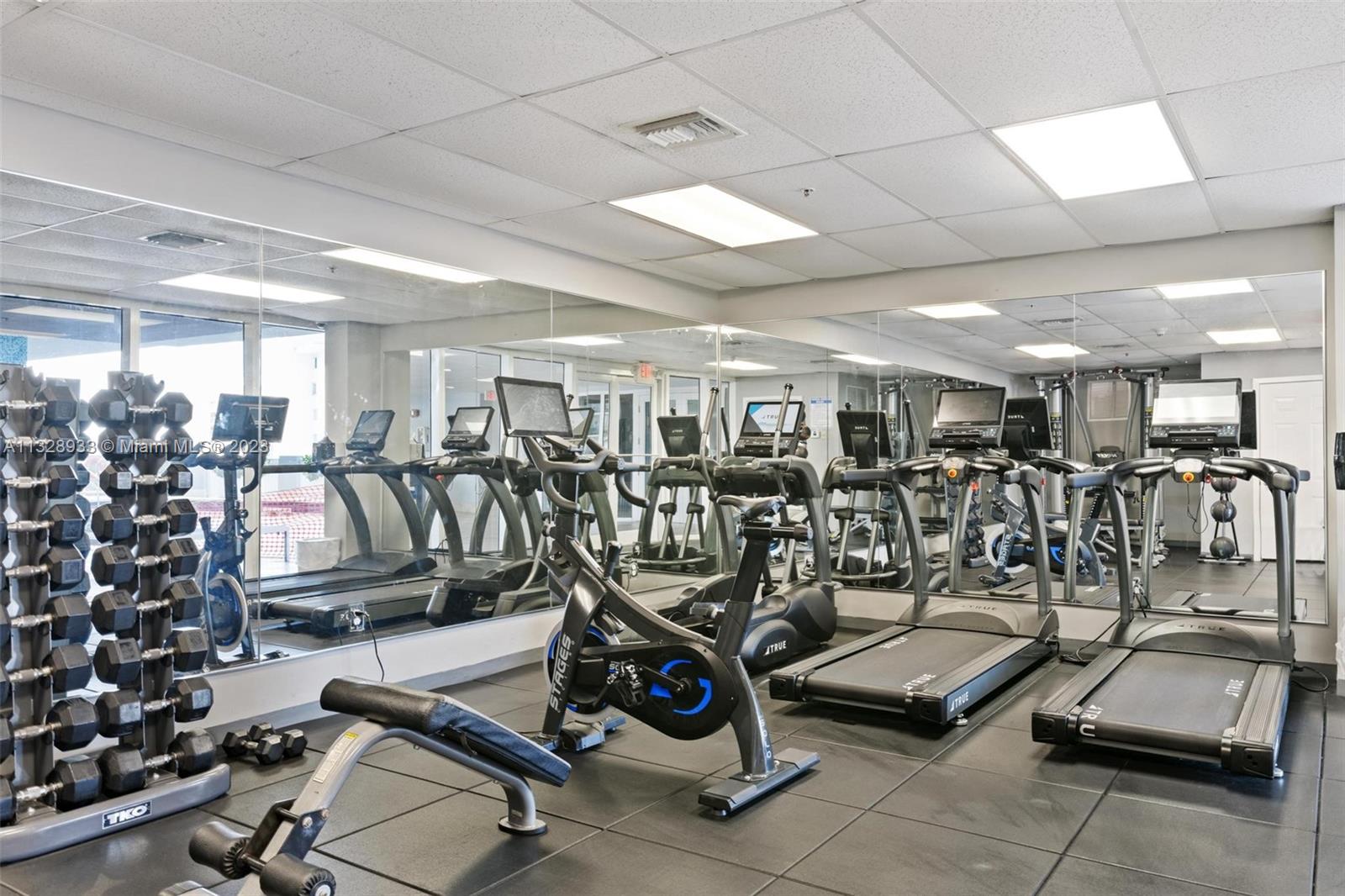 170 Southeast 14th Street, Unit 1906 Miami, FL 33131 - Photo 24 of 26 a view of a room with gym equipment