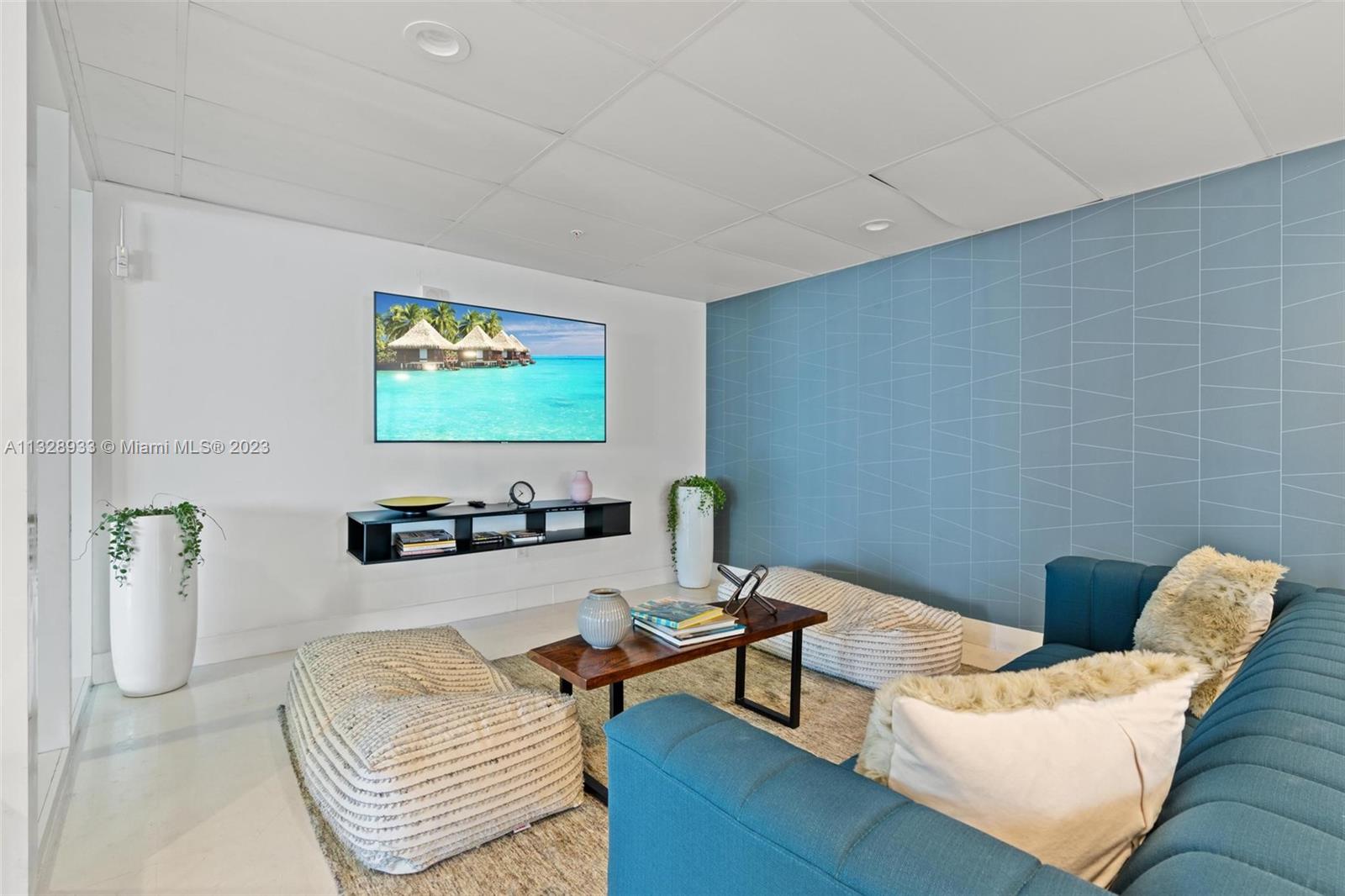 170 Southeast 14th Street, Unit 1906 Miami, FL 33131 - Photo 26 of 26 a living room with furniture and a flat screen tv