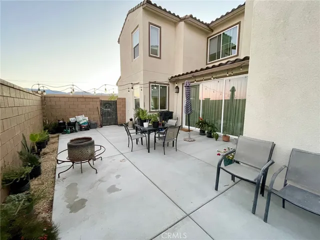 an outdoor view of house with outdoor seating
