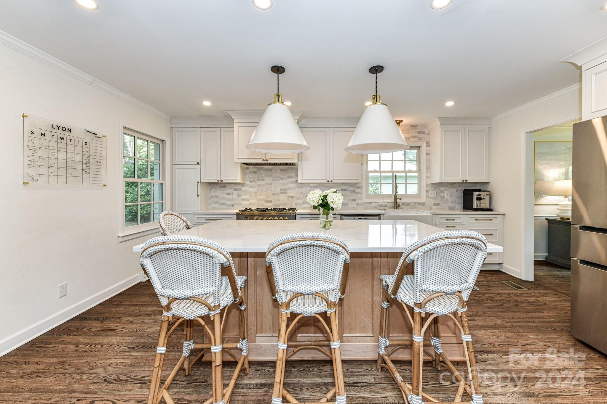 3026 Rustic Lane Charlotte, NC 28210 - Photo 11 of 39 a kitchen with granite countertop a dining table chairs stainless steel appliances and cabinets
