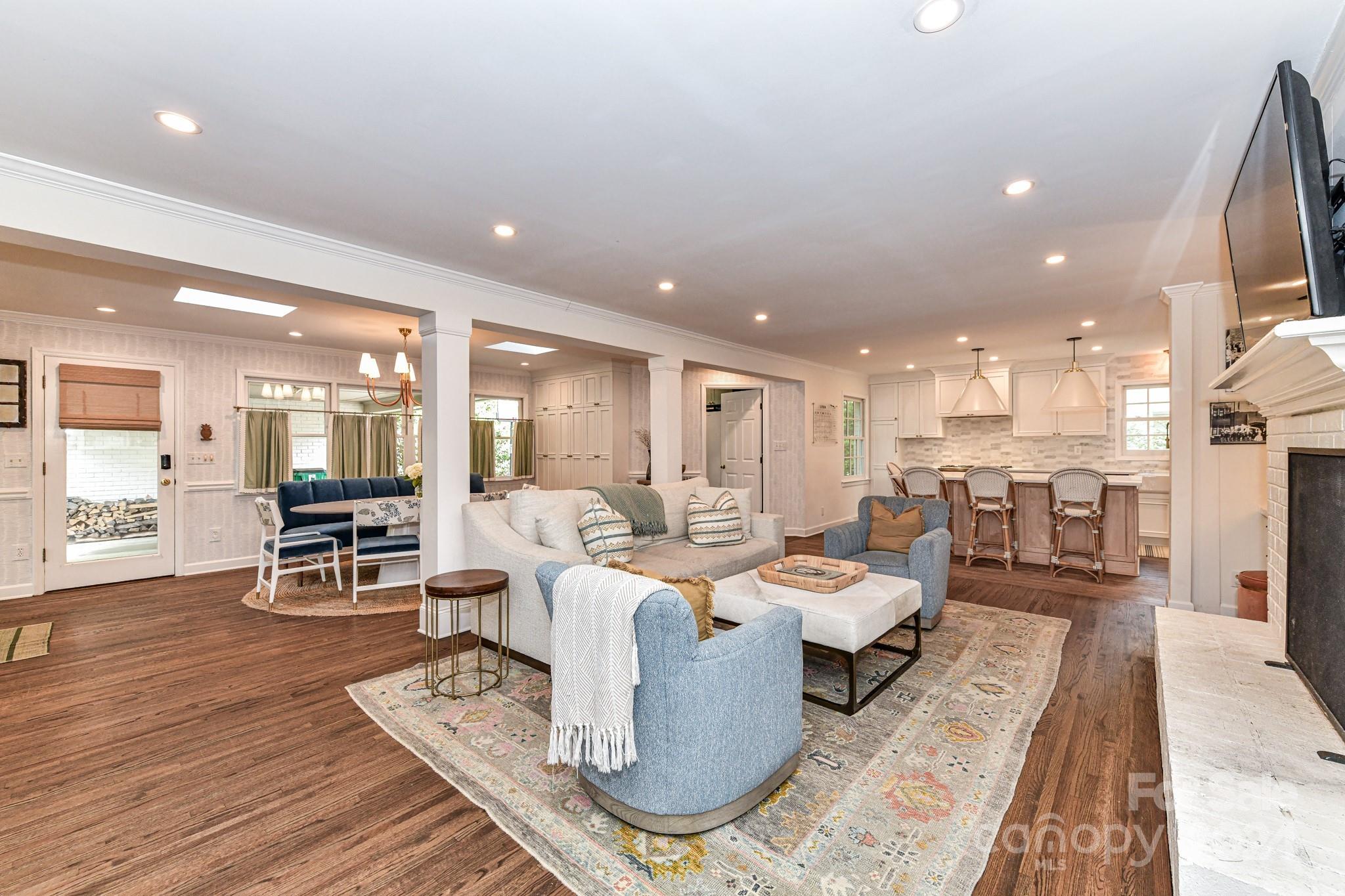 3026 Rustic Lane Charlotte, NC 28210 - Photo 19 of 39 a living room with lots of furniture and kitchen view
