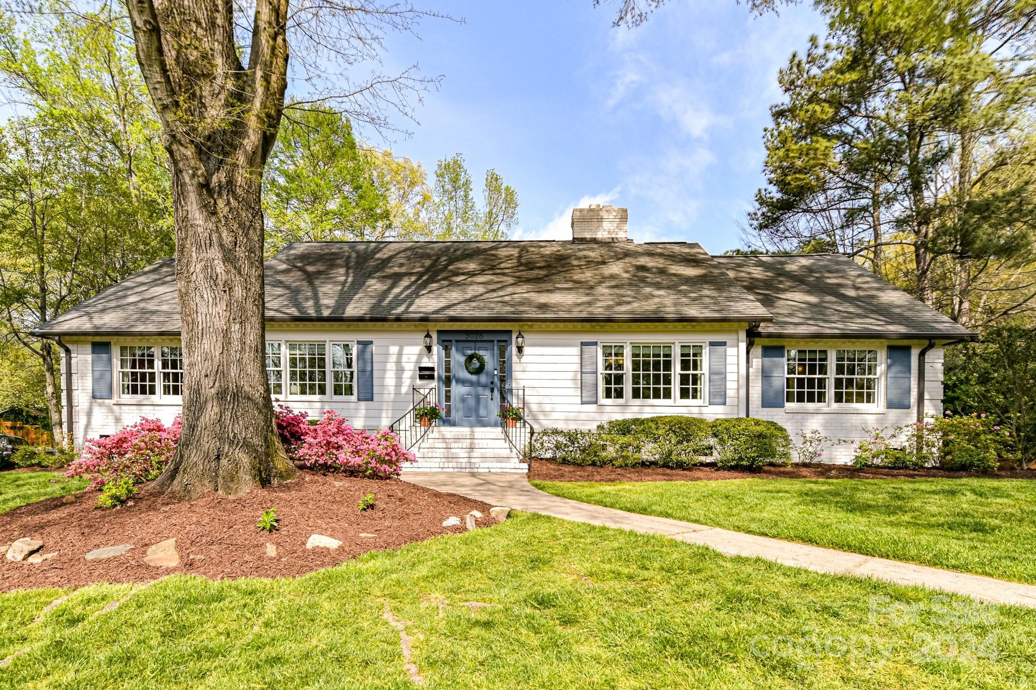 3026 Rustic Lane Charlotte, NC 28210 - Photo 2 of 39 a front view of a house with garden