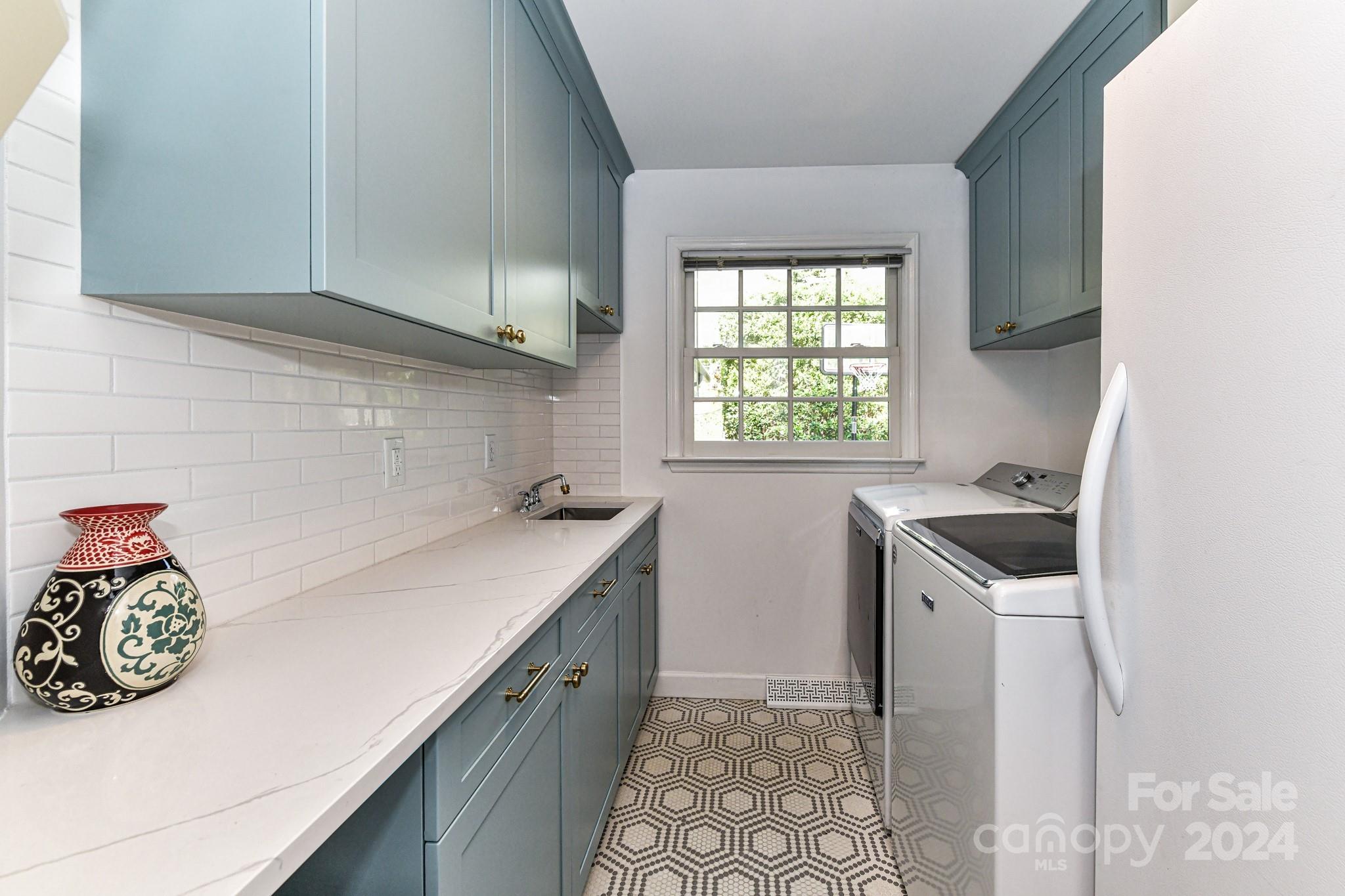 3026 Rustic Lane Charlotte, NC 28210 - Photo 27 of 39 a kitchen with a sink a stove top oven and cabinets