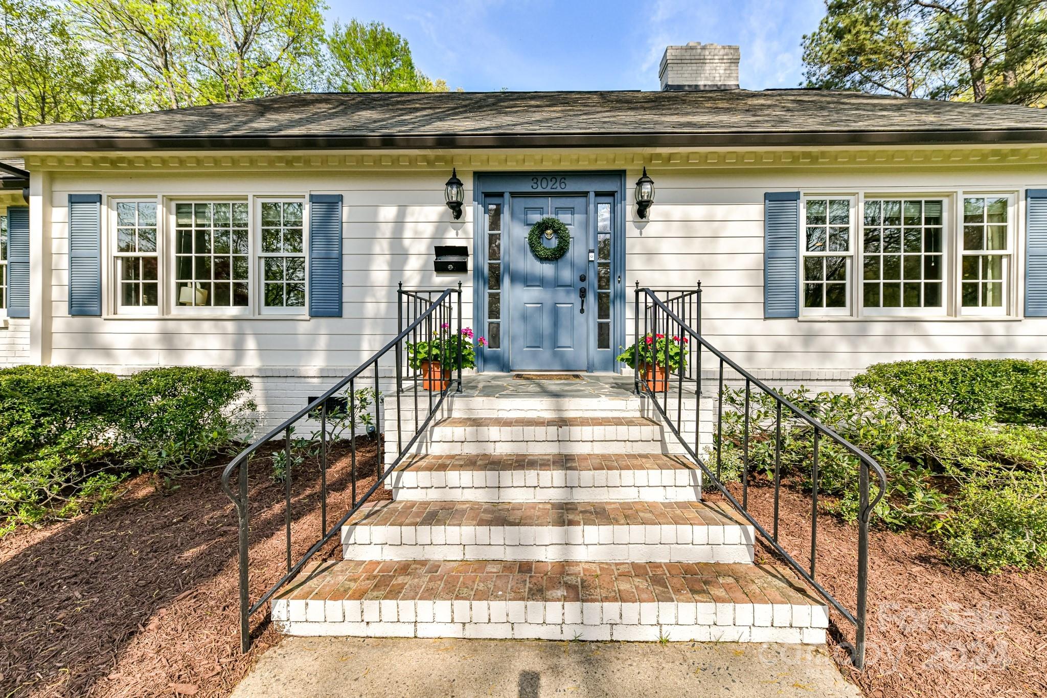3026 Rustic Lane Charlotte, NC 28210 - Photo 3 of 39 a front view of a house with a porch