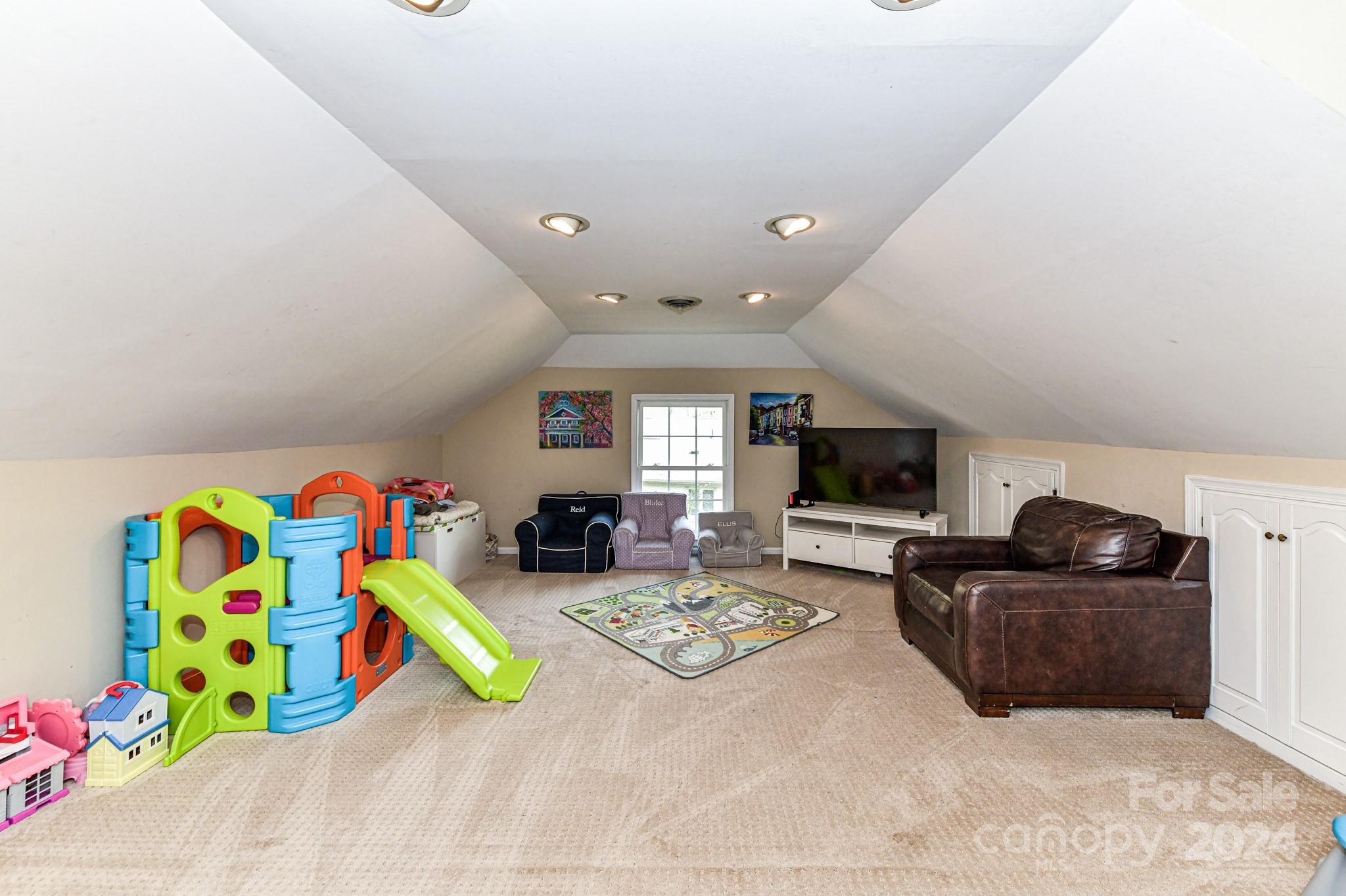 3026 Rustic Lane Charlotte, NC 28210 - Photo 32 of 39 a living room with furniture and a flat screen tv
