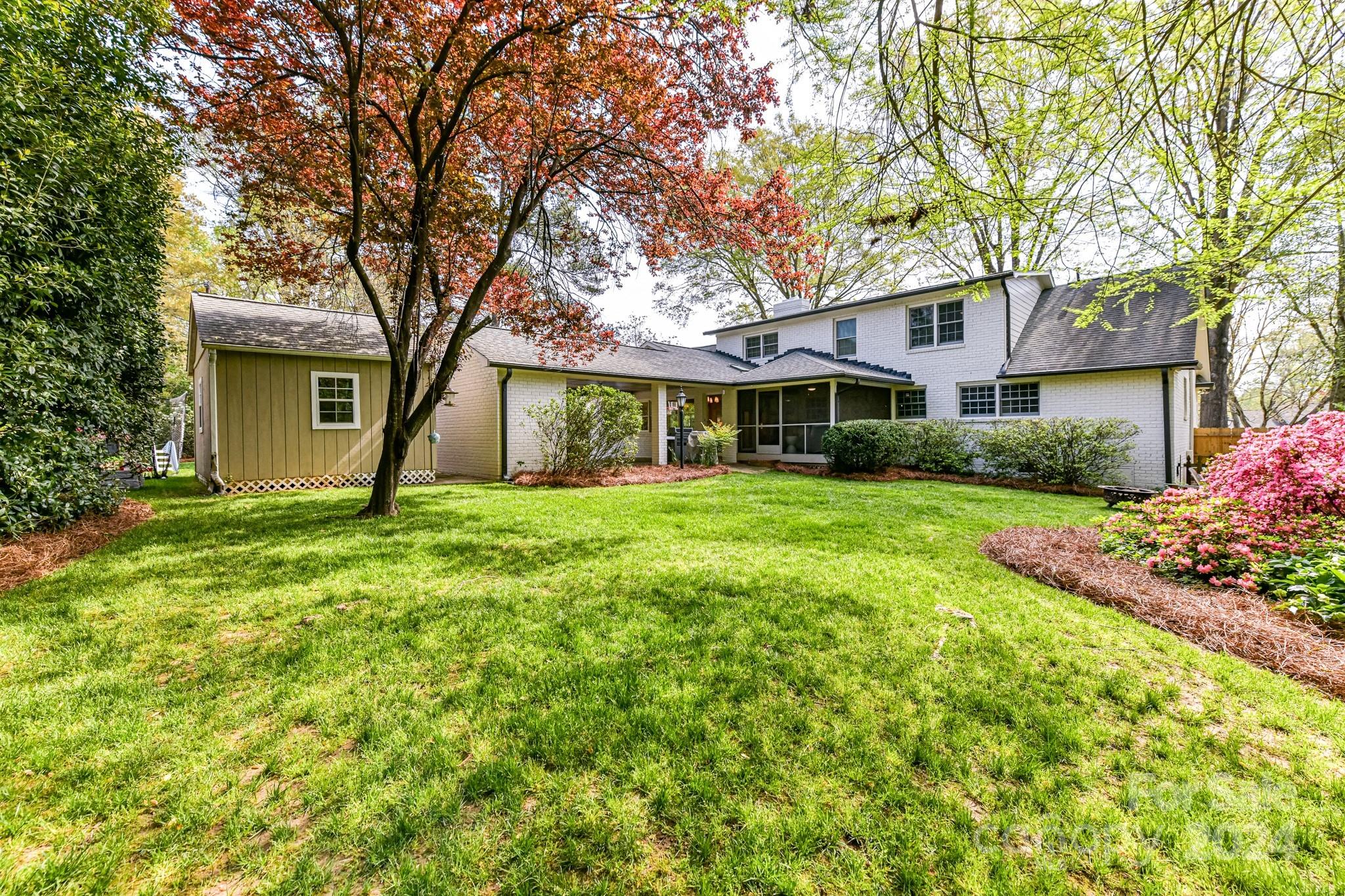 3026 Rustic Lane Charlotte, NC 28210 - Photo 36 of 39 a front view of house with yard and green space
