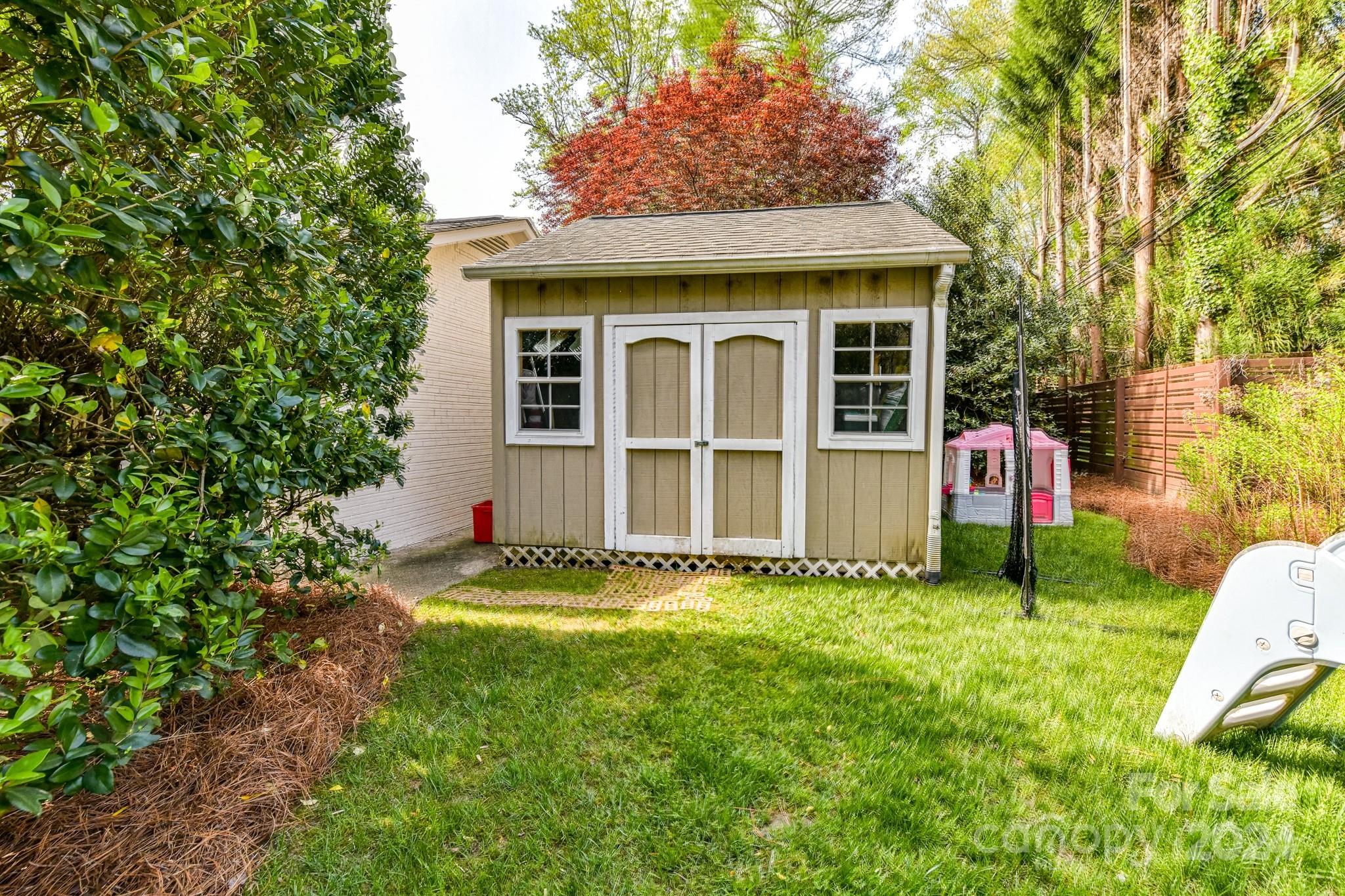 3026 Rustic Lane Charlotte, NC 28210 - Photo 39 of 39 a front view of a house with a yard