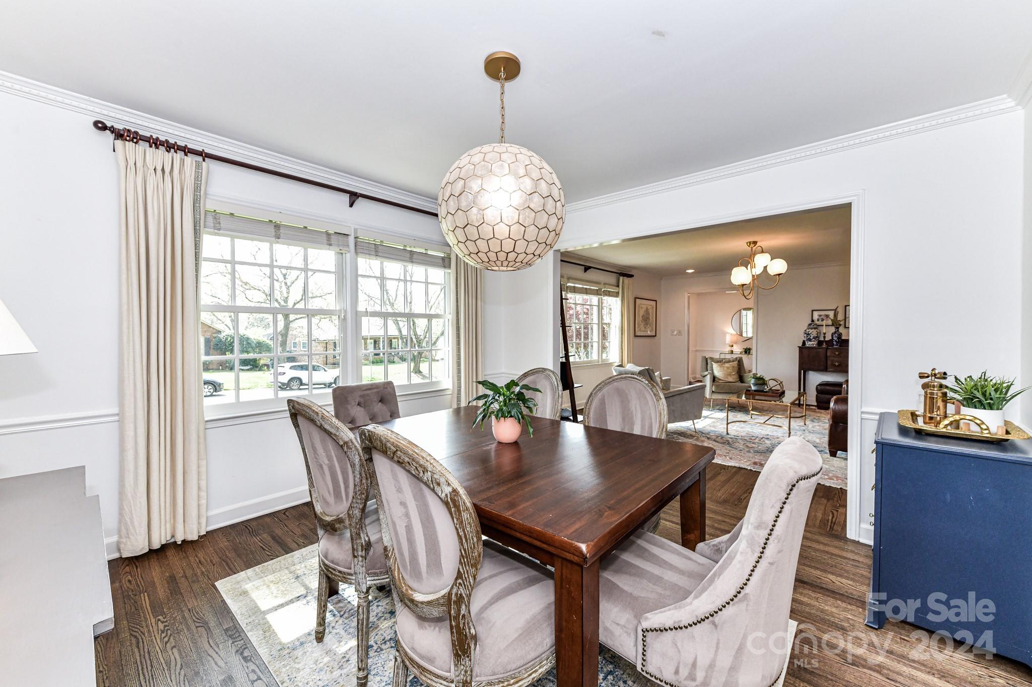 3026 Rustic Lane Charlotte, NC 28210 - Photo 9 of 39 a view of a dining room with furniture wooden floor and chandelier