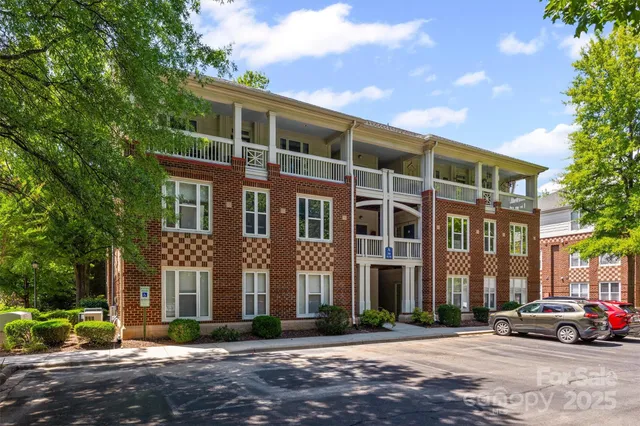 a city street lined with buildings and trees