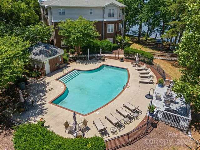 an aerial view of a house with garden space and street view