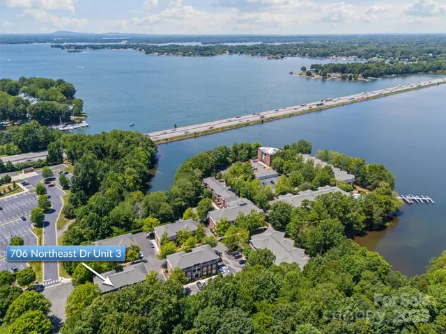 an aerial view of a house with a lake view