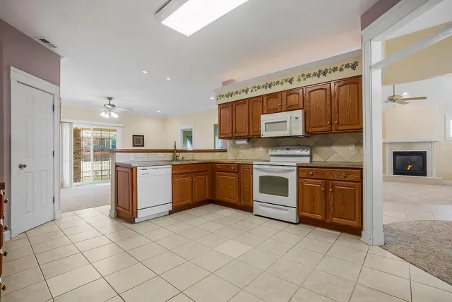 $365,000 | 614 Meadow Lark Drive, Raymore, MO 64083