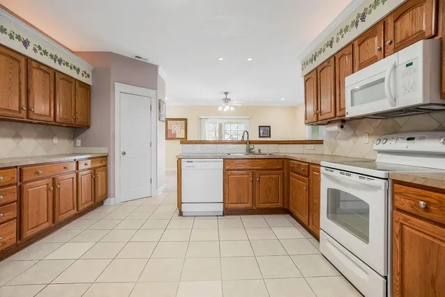 $365,000 | 614 Meadow Lark Drive, Raymore, MO 64083