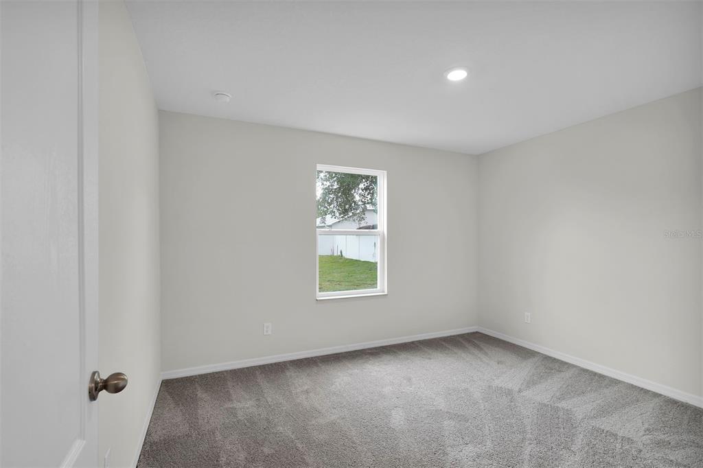 15605 Southwest 49th Avenue Road Ocala, FL 34473 - Photo 13 of 15 an empty room with a window
