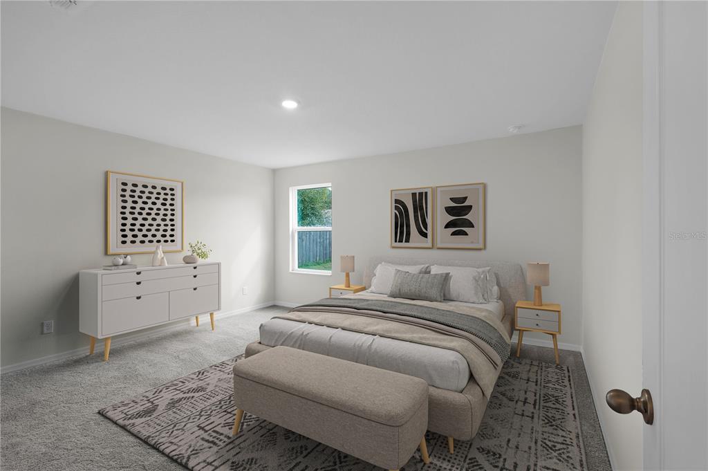 15605 Southwest 49th Avenue Road Ocala, FL 34473 - Photo 8 of 15 a bedroom with a bed and a window