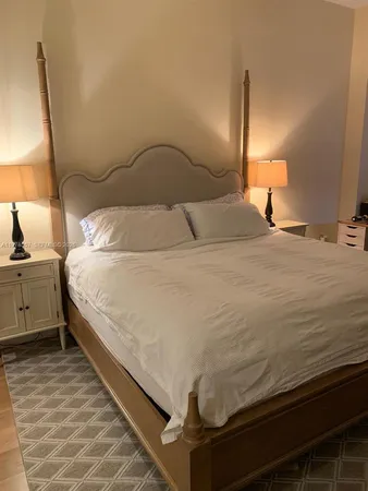 a bathroom with a sink a mirror and shower