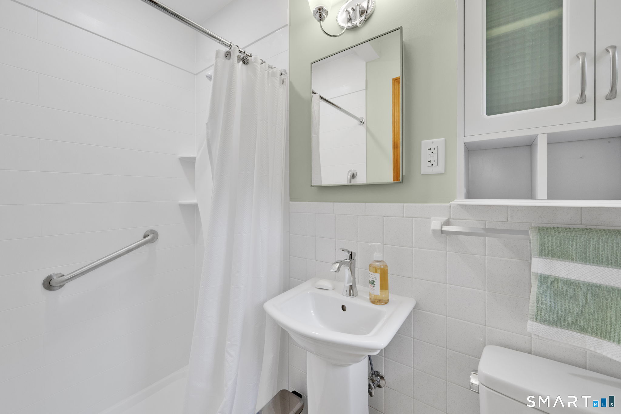 158 Notch Road Granby, CT 06035 - Photo 24 of 40 a bathroom with a sink mirror and toilet