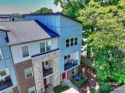 a aerial view of a house yard and balcony