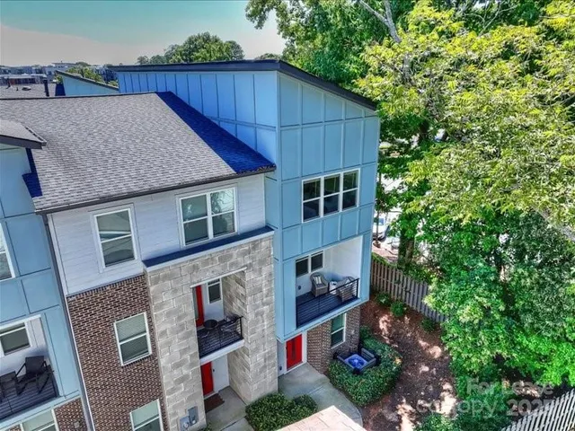 a aerial view of a house yard and balcony
