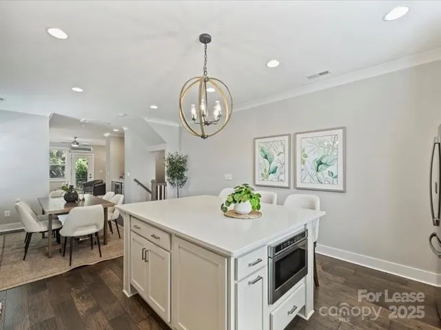 a view of dining table and chairs in a room