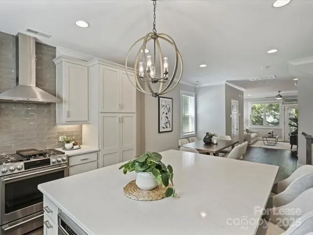 a kitchen with a table and chairs